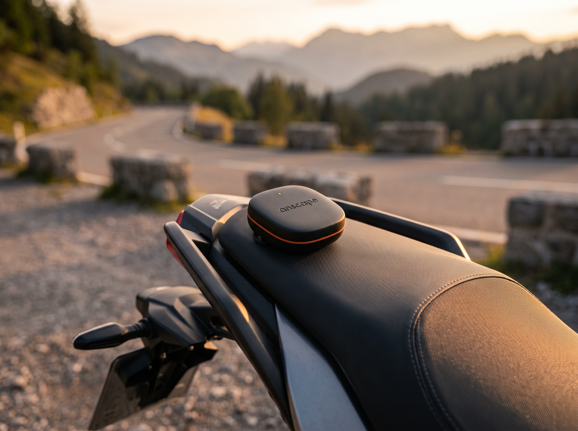 Close-up of the anscape puck mounted on a motorcycle tail section behind the rider seat